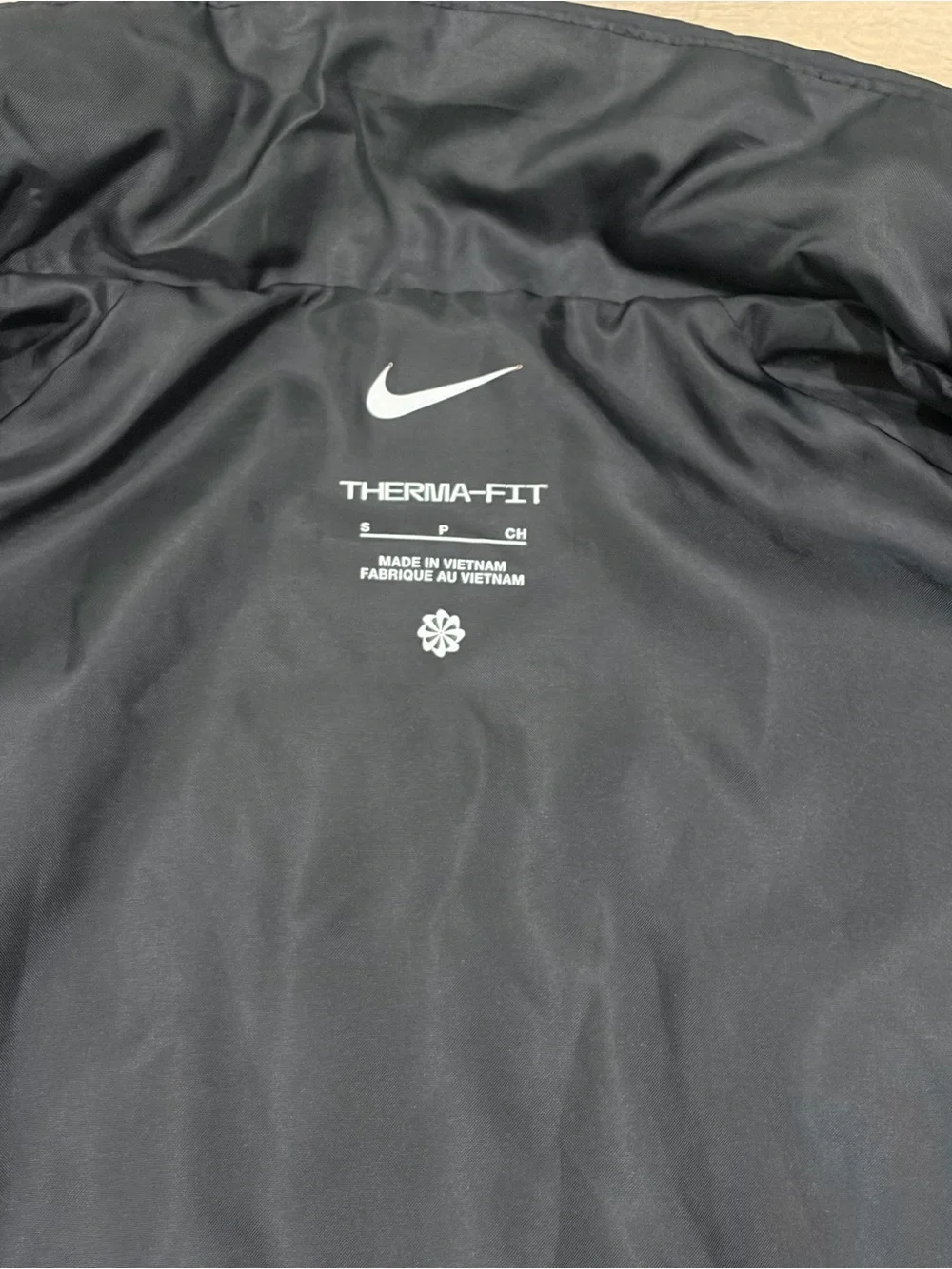 Nike women’s Black Quilted Vest with White Swoosh